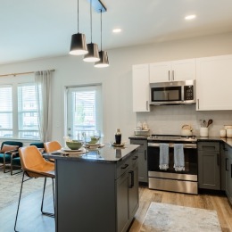 a kitchen with white cabinets