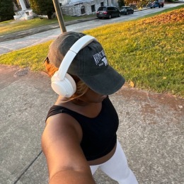 a woman walking with headphones