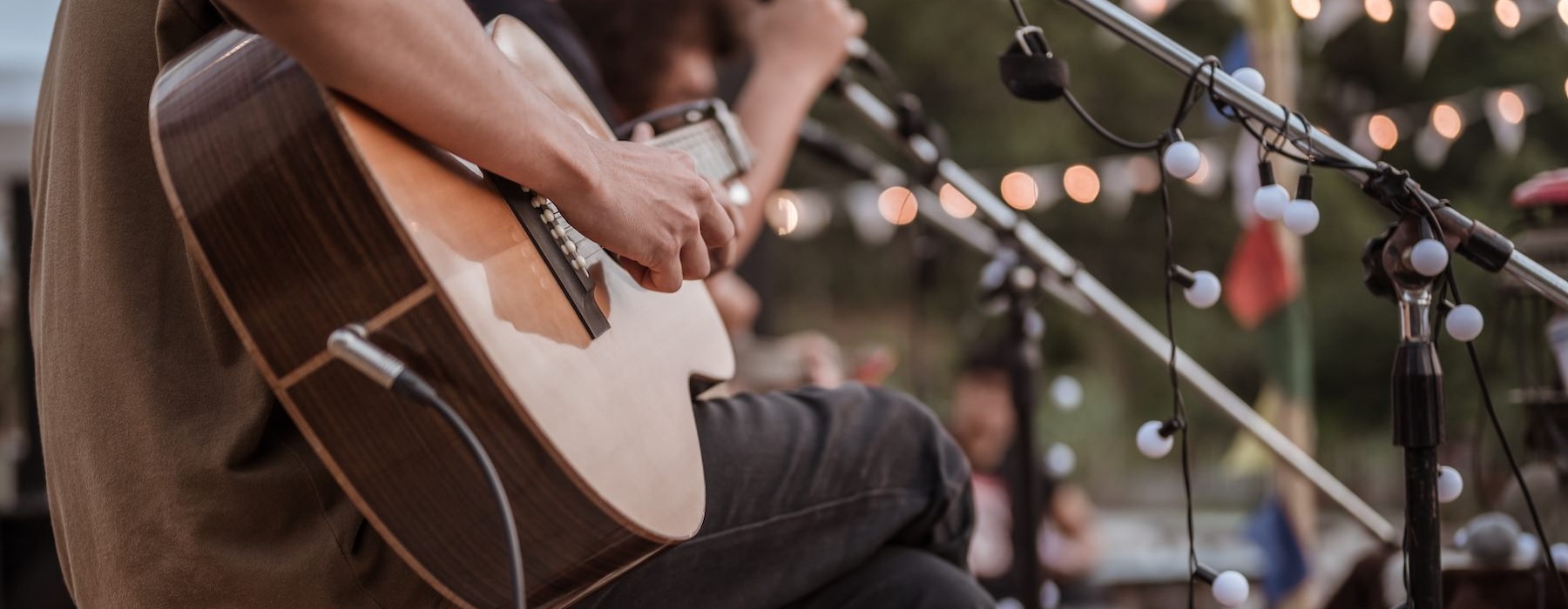 a person playing a guitar