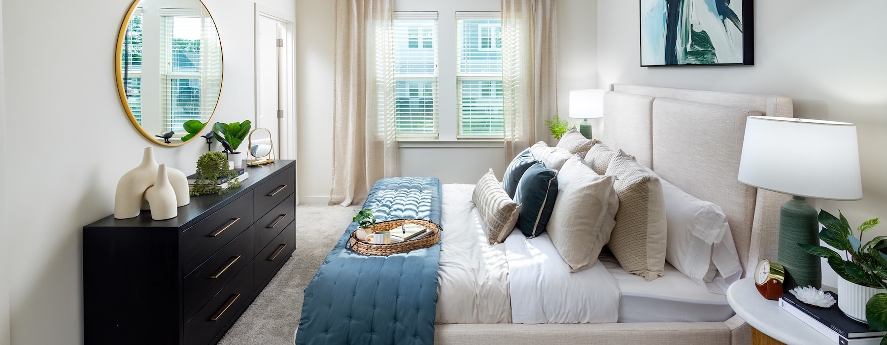 a bedroom with a bed and a mirror