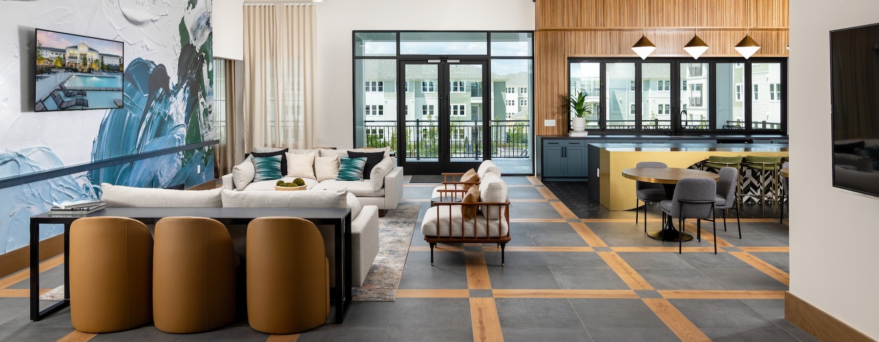 a clubroom with couches, tables and chairs