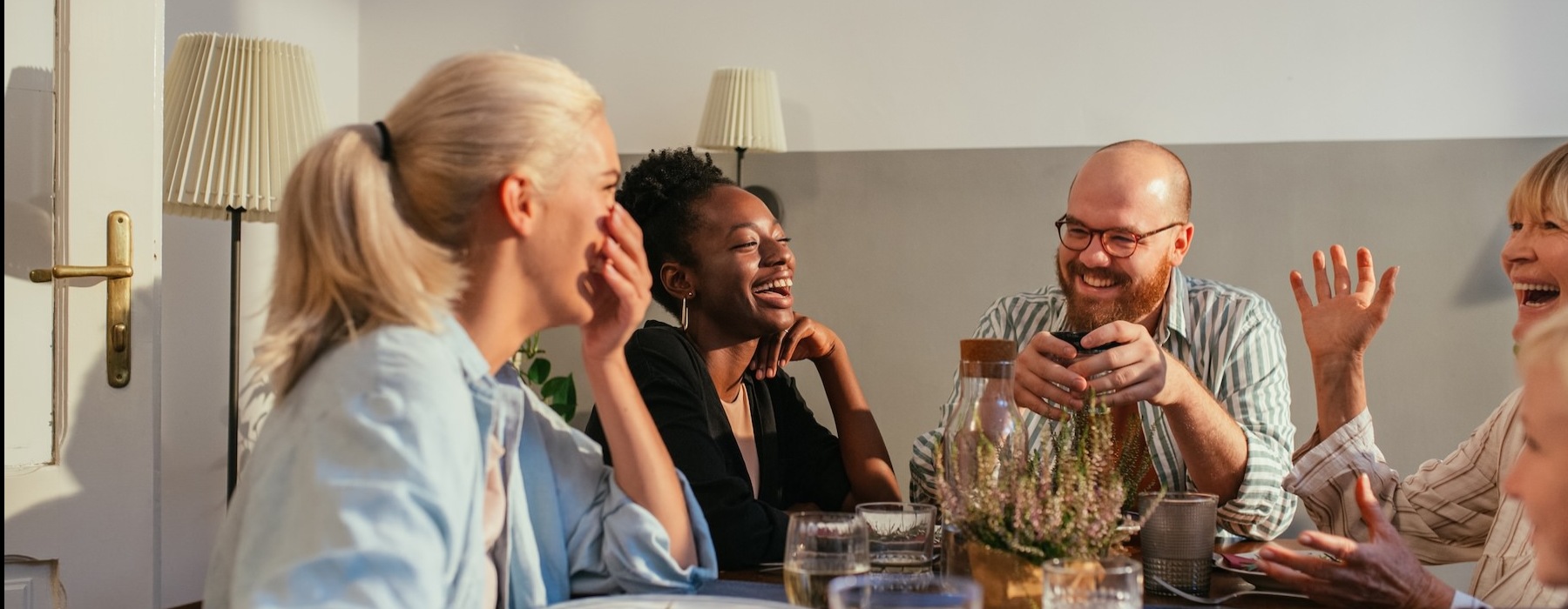 a group of people sitting around a table