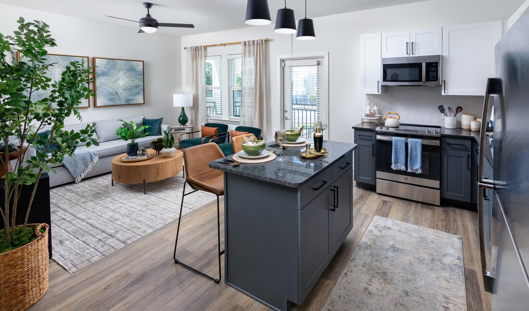 a kitchen with an island and chairs